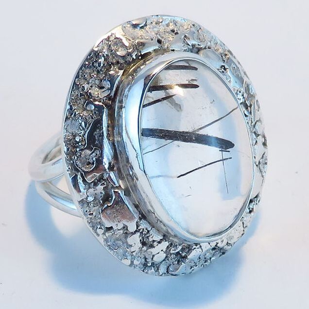 Handmade sterling silver ring with bezel-set clear quartz with tourmaline crystals en cabochon